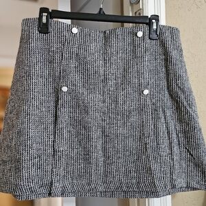Tweed A-line mini skirt with metallic buttons and side zipper